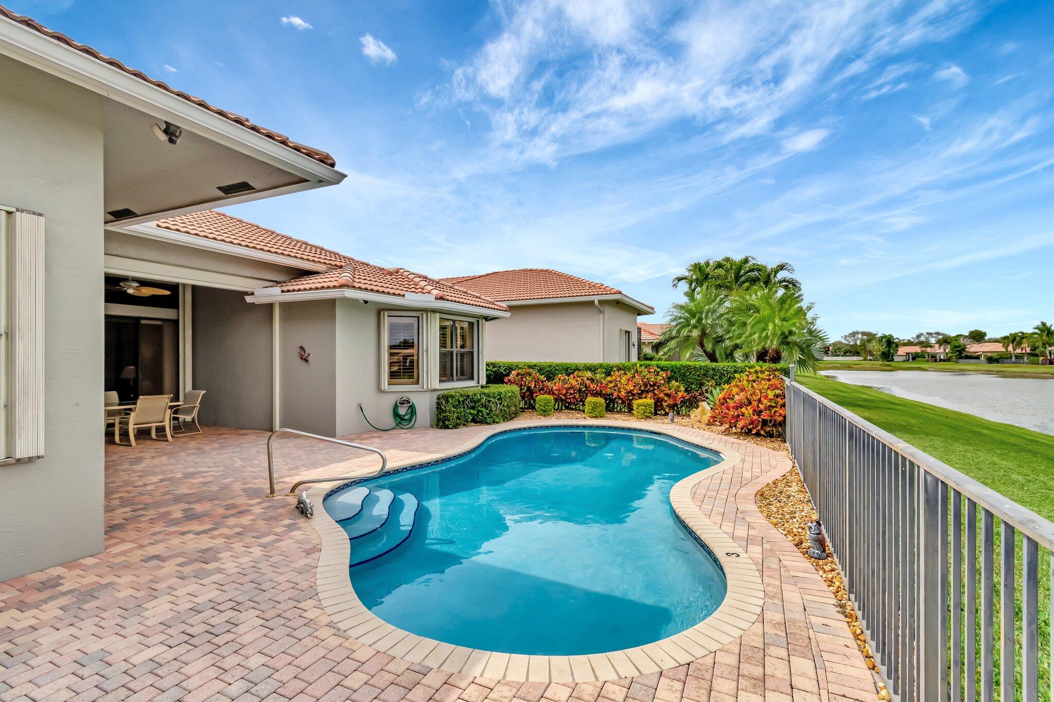 6976 Antinori Lane Boynton Beach, FL 33437 - Photo 3 of 71 a view of a house with swimming pool and porch