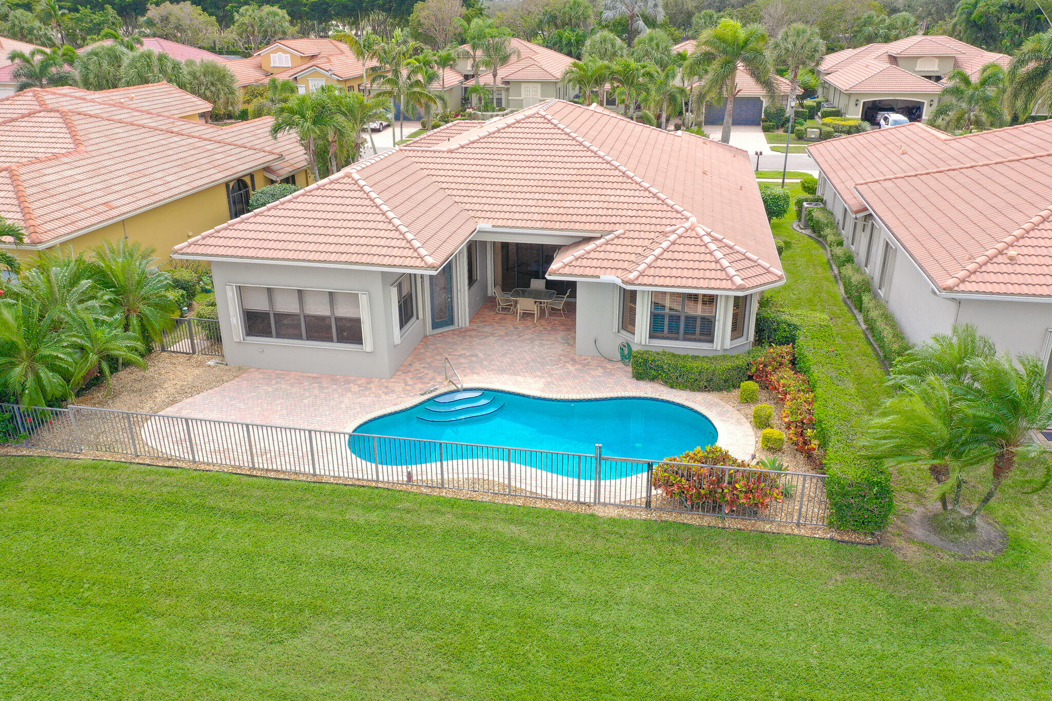 6976 Antinori Lane Boynton Beach, FL 33437 - Photo 4 of 71 a view of a house with a backyard and swimming pool