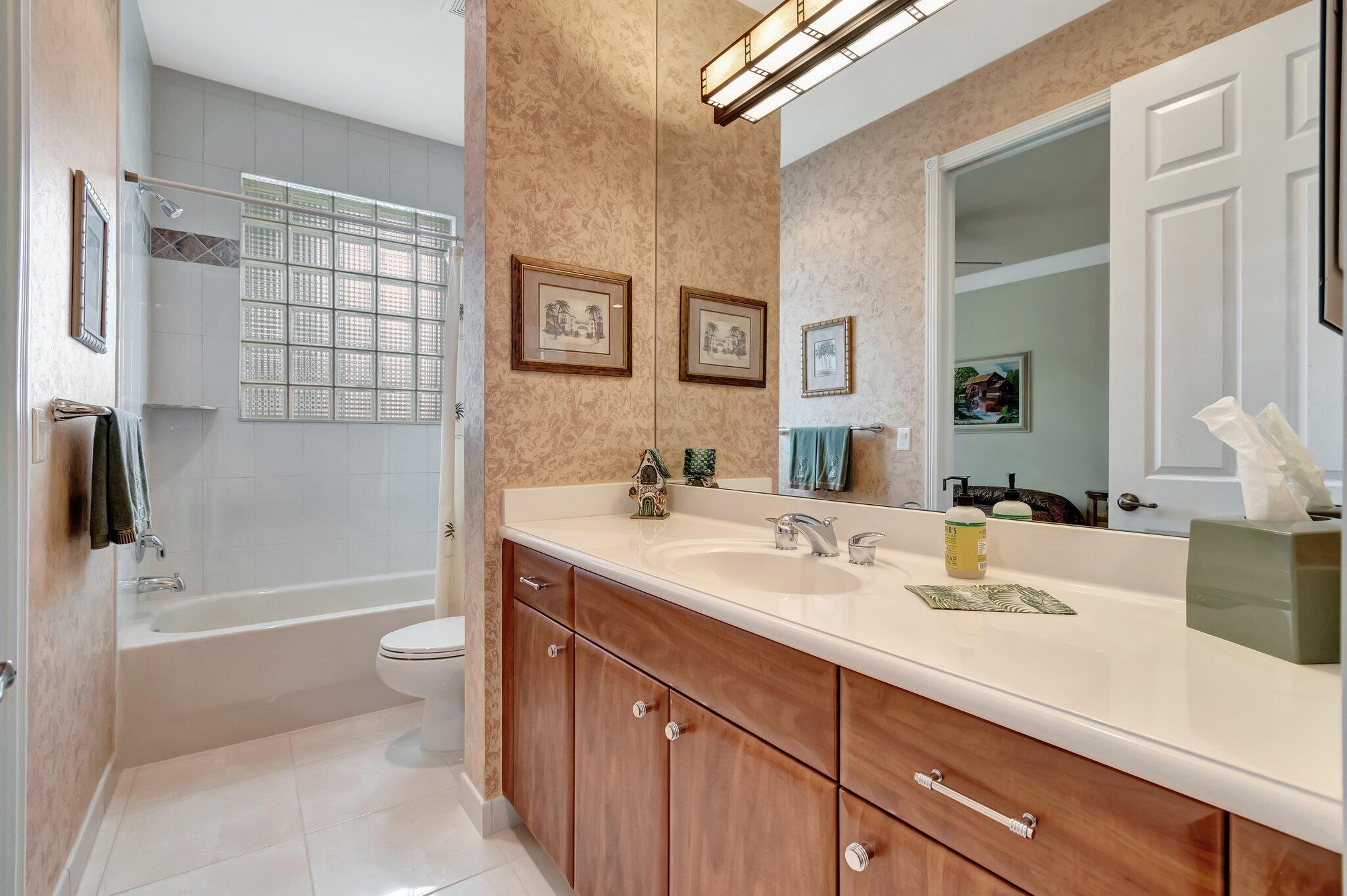 6976 Antinori Lane Boynton Beach, FL 33437 - Photo 41 of 71 a bathroom with a sink a toilet and shower