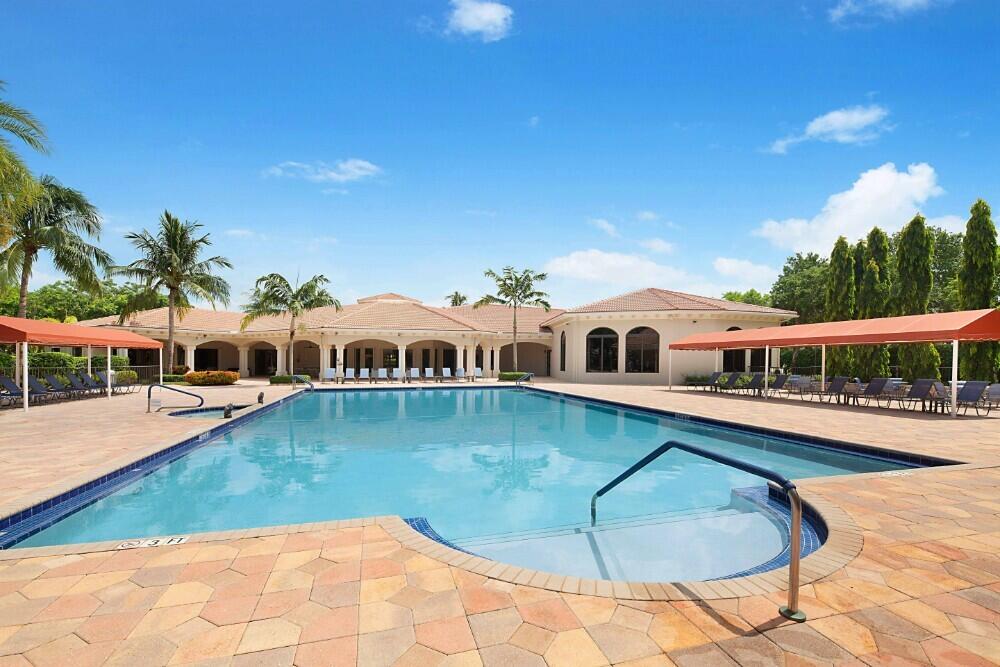 6976 Antinori Lane Boynton Beach, FL 33437 - Photo 56 of 71 a view of a house with pool and sitting area