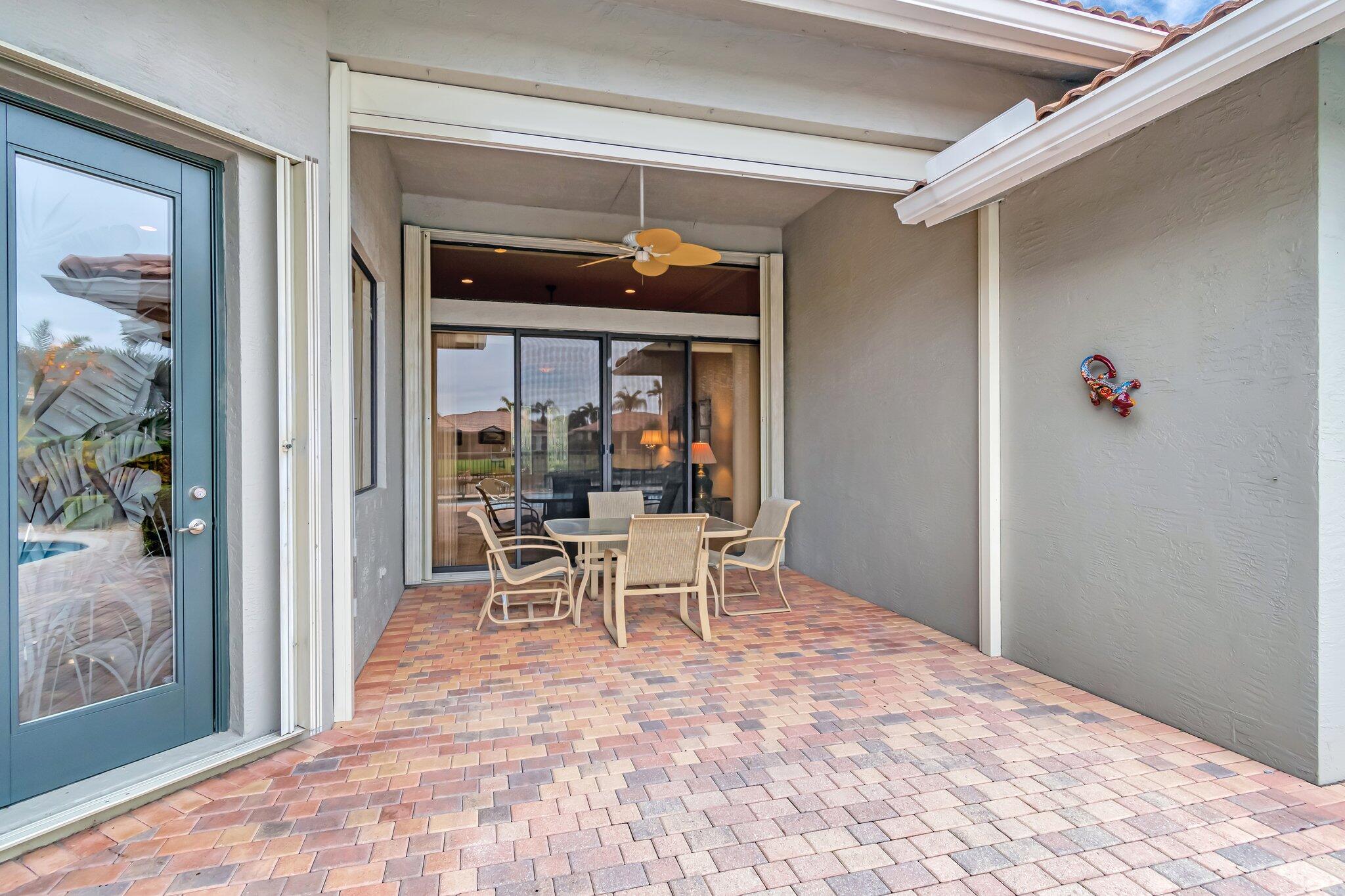 6976 Antinori Lane Boynton Beach, FL 33437 - Photo 7 of 71 a view of a dining room with a table and chairs