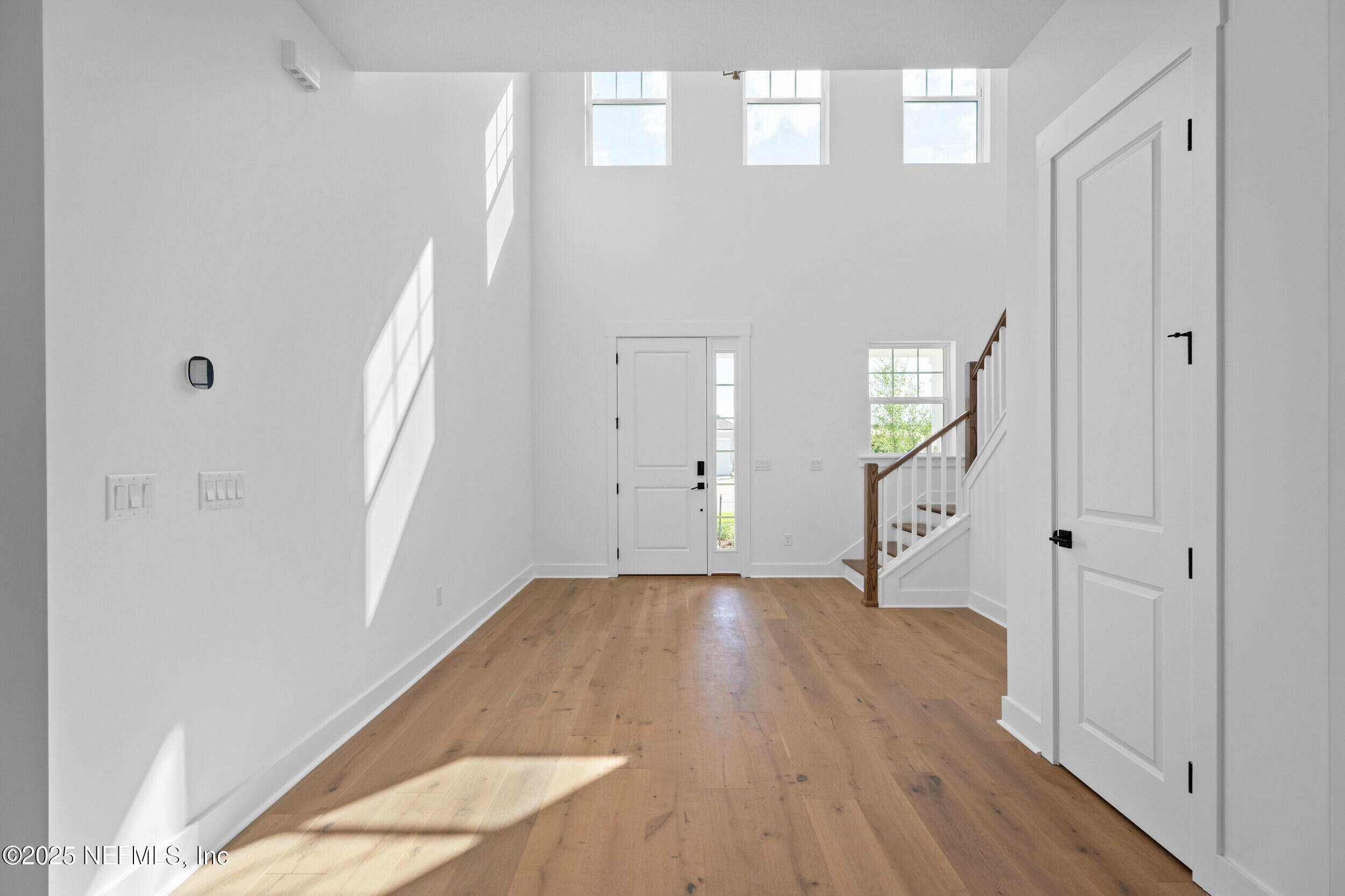 103 Reflections Avenue Ponte Vedra, FL 32081 - Photo 12 of 38 a view of a hallway with wooden floor and entryway