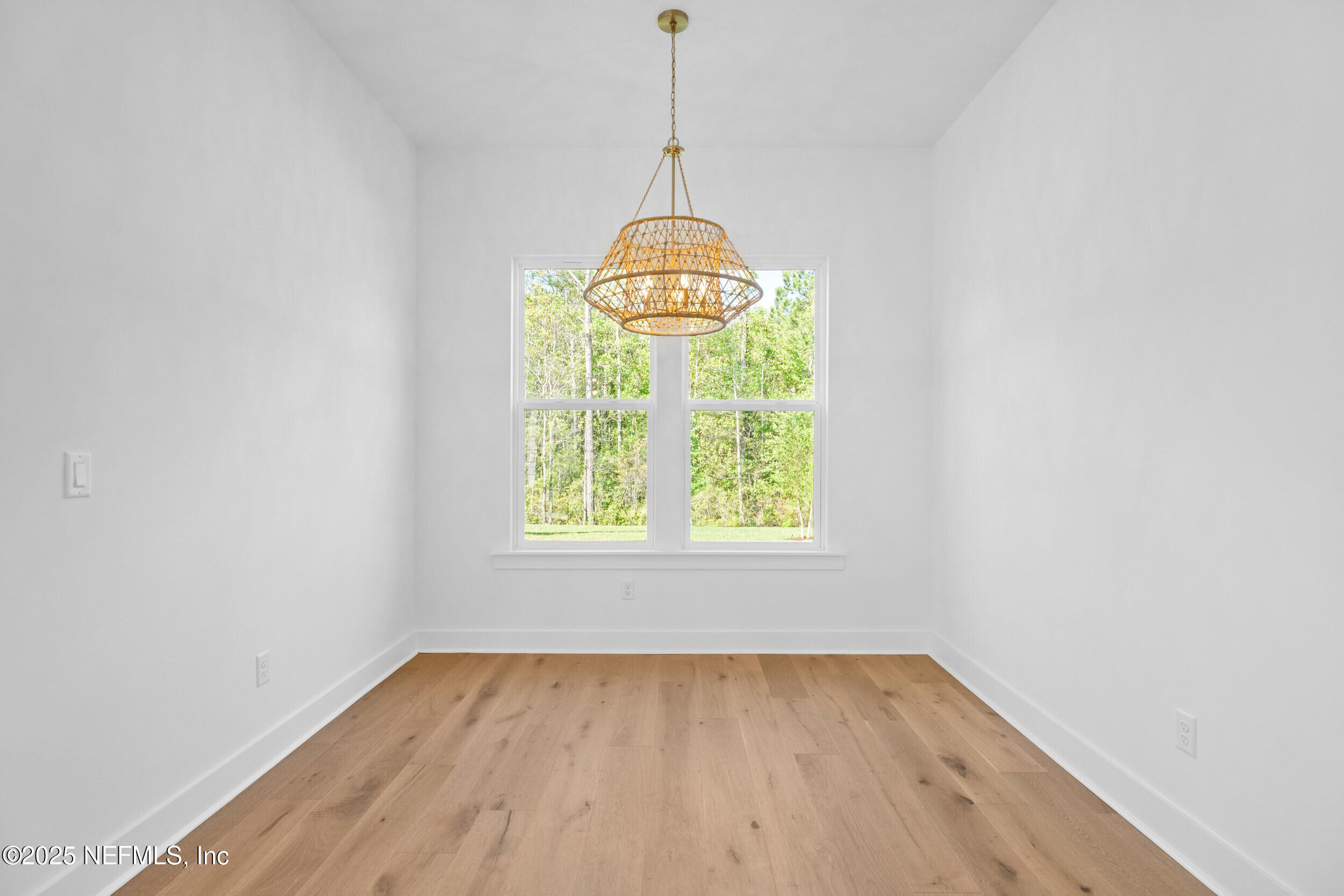 103 Reflections Avenue Ponte Vedra, FL 32081 - Photo 15 of 38 an empty room with wooden floor and windows