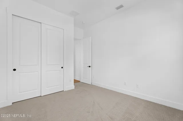 a bathroom with a sink toilet vanity and shower