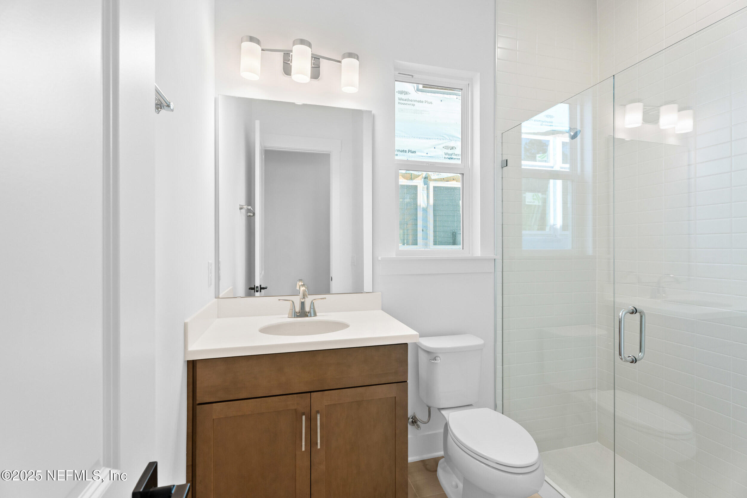 103 Reflections Avenue Ponte Vedra, FL 32081 - Photo 32 of 38 a bathroom with a sink toilet vanity and shower