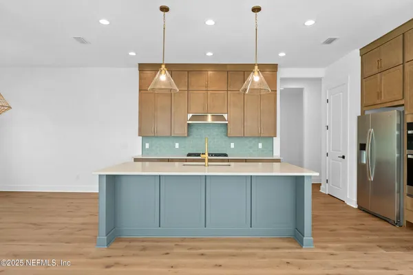 a bathroom with a sink a large mirror and a shower