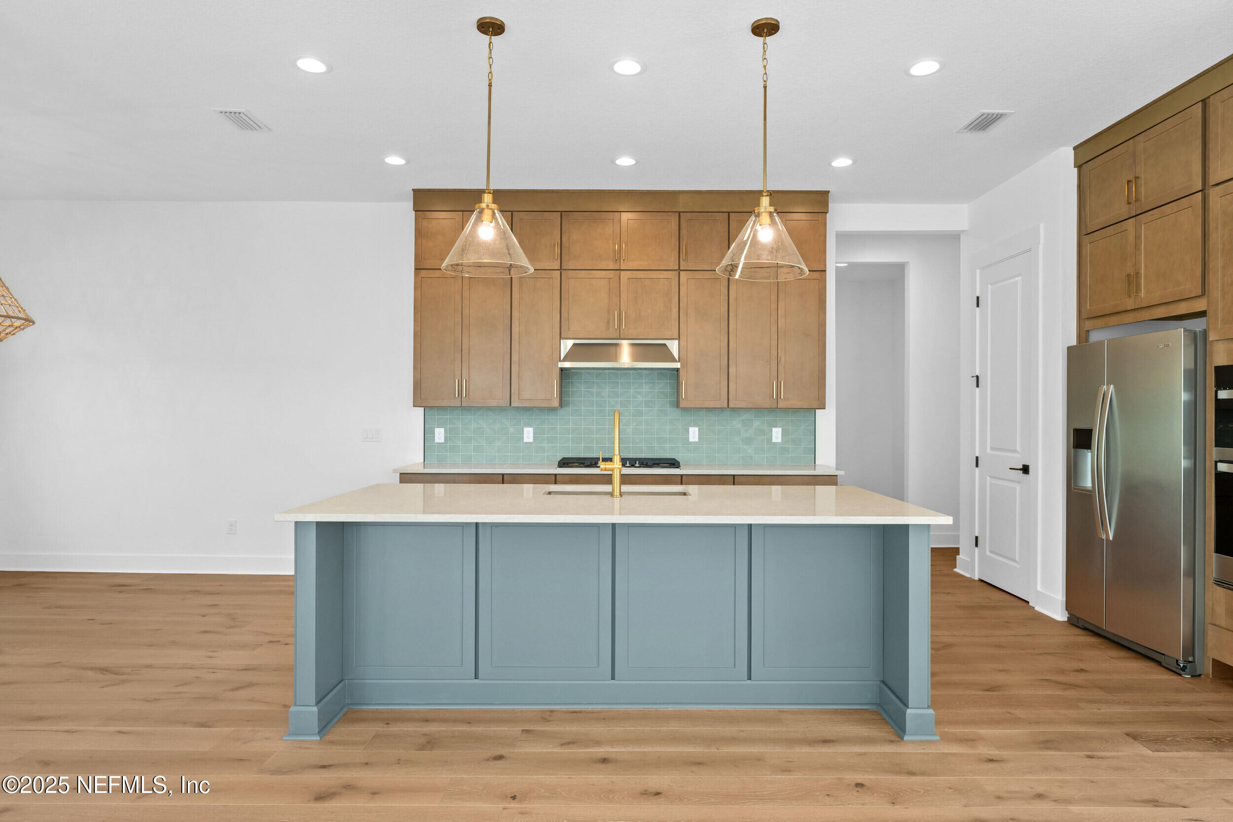 103 Reflections Avenue Ponte Vedra, FL 32081 - Photo 5 of 38 a bathroom with a sink a large mirror and a shower