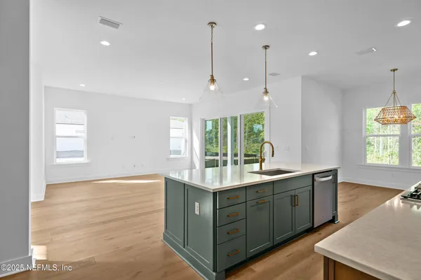 a kitchen with a sink and window