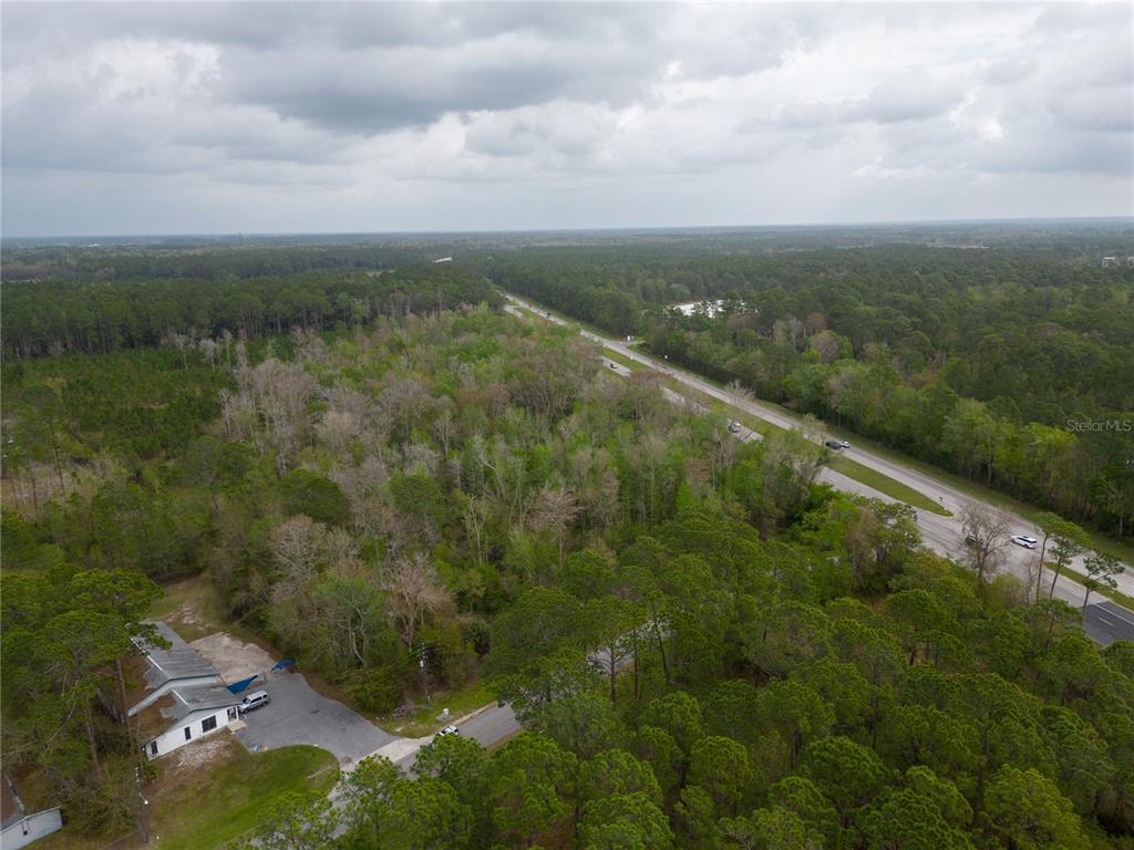 Tbd Northeast Waldo Road Gainesville, FL 32609 - Photo 4 of 10 an aerial view of residential houses with outdoor space and trees