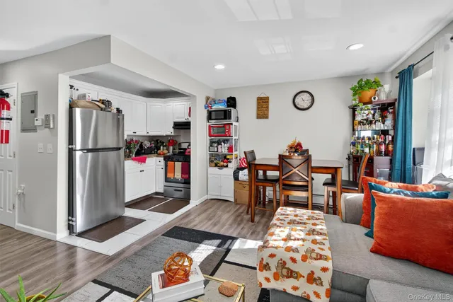 a very nice looking room with a glass top table and a chair