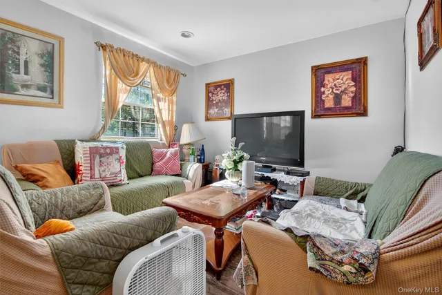 a bed room with a bed a mirror on desk and chair