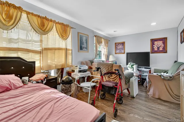 a kitchen that has a refrigerator a stove and a wooden floor