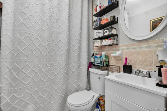 a bedroom with a bed and flat screen tv