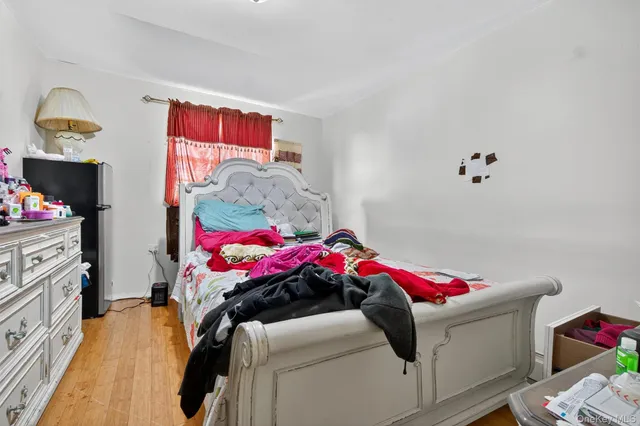 a view of a kitchen with a sink and a refrigerator
