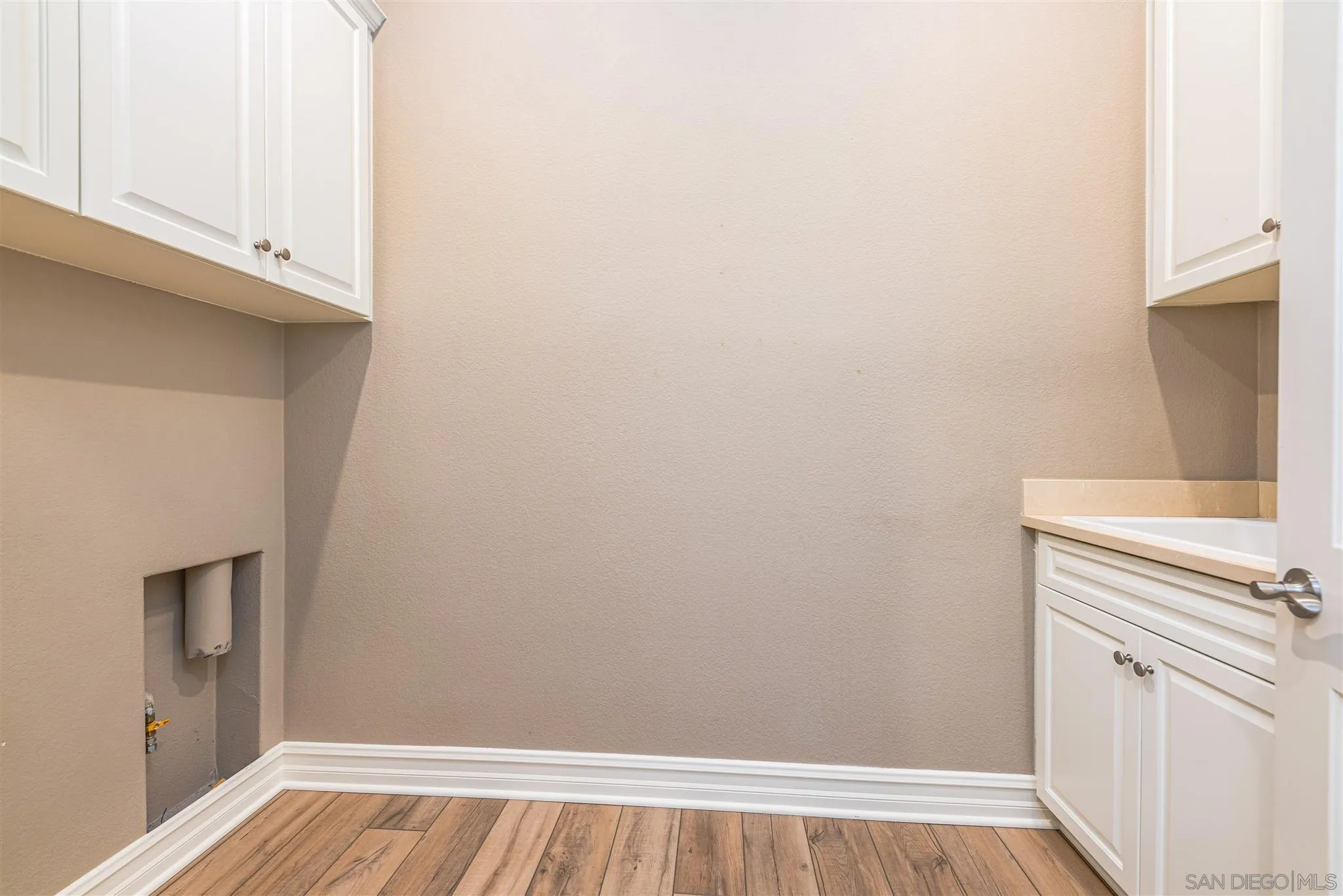 5172 Corte Cerro Hemet, CA 92545 - Photo 13 of 36 a view of a kitchen with white cabinets and a stove