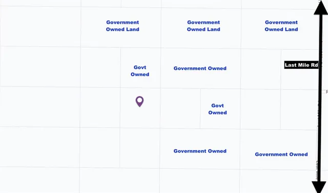 a view of a large mountain with mountains in the background