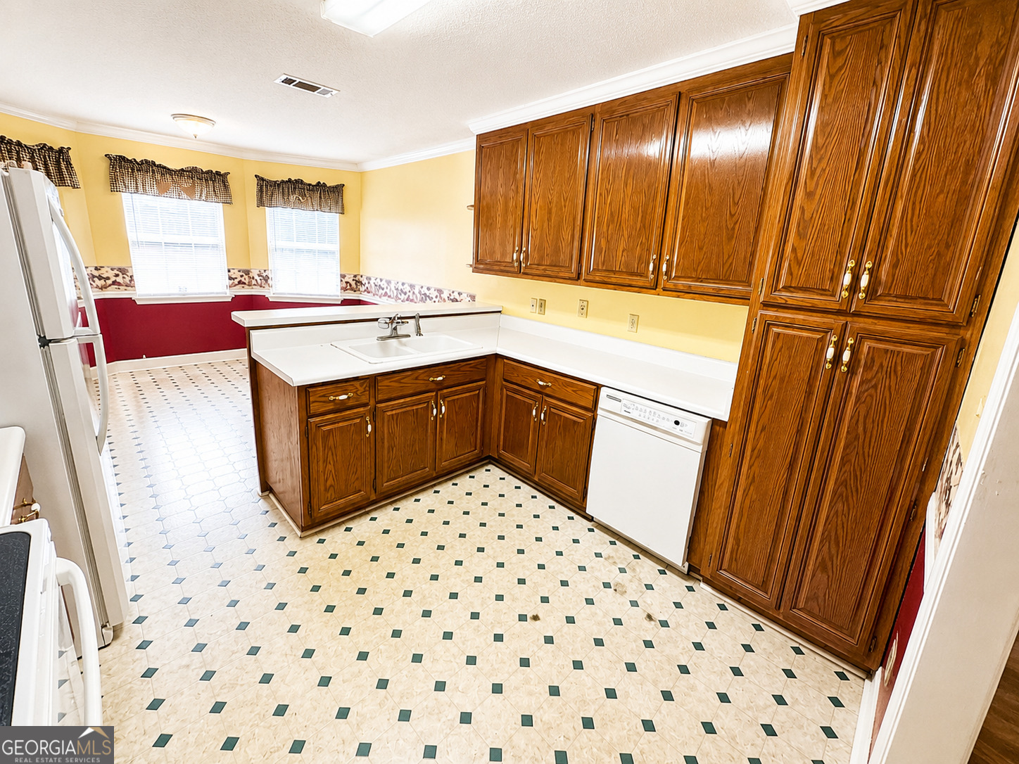 959 Lovers Lane Road Leesburg, GA 31763 - Photo 7 of 19 a kitchen with a sink a stove cabinets and a wooden floor
