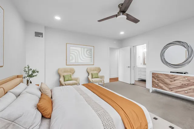 a bathroom with a sink toilet a mirror and shower