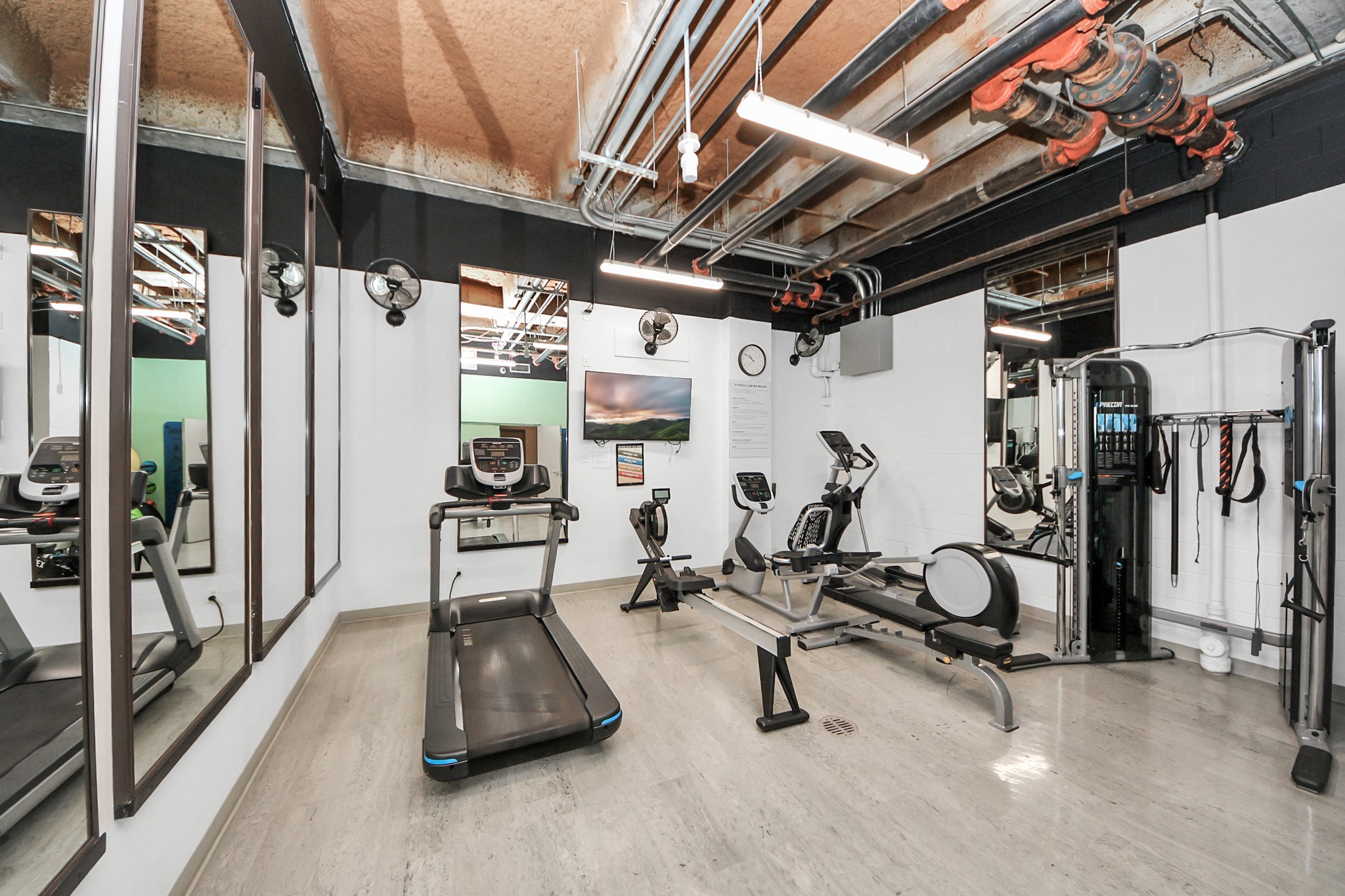 5000 Montrose Boulevard, Unit 14H Houston, TX 77006 - Photo 31 of 40 a view of a room with gym equipment