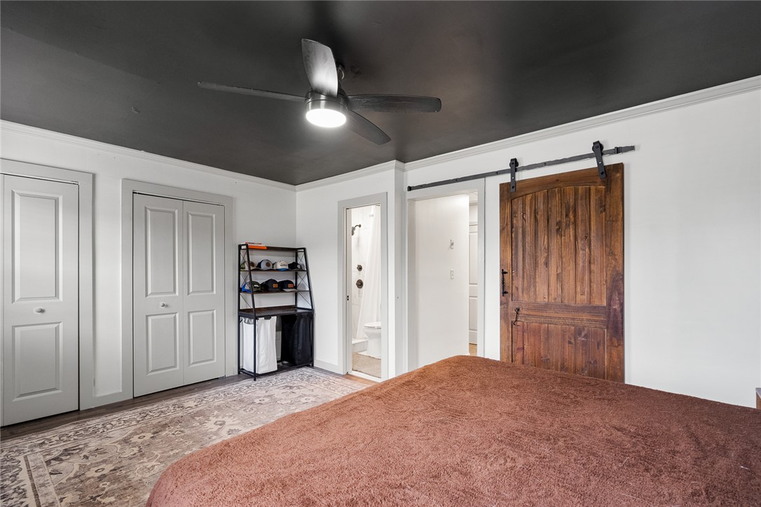 4508 Old Williamston Road Belton, SC 29627 - Photo 15 of 47 This private sanctuary features charming bi-fold closet doors and an elegant barn door entrance.