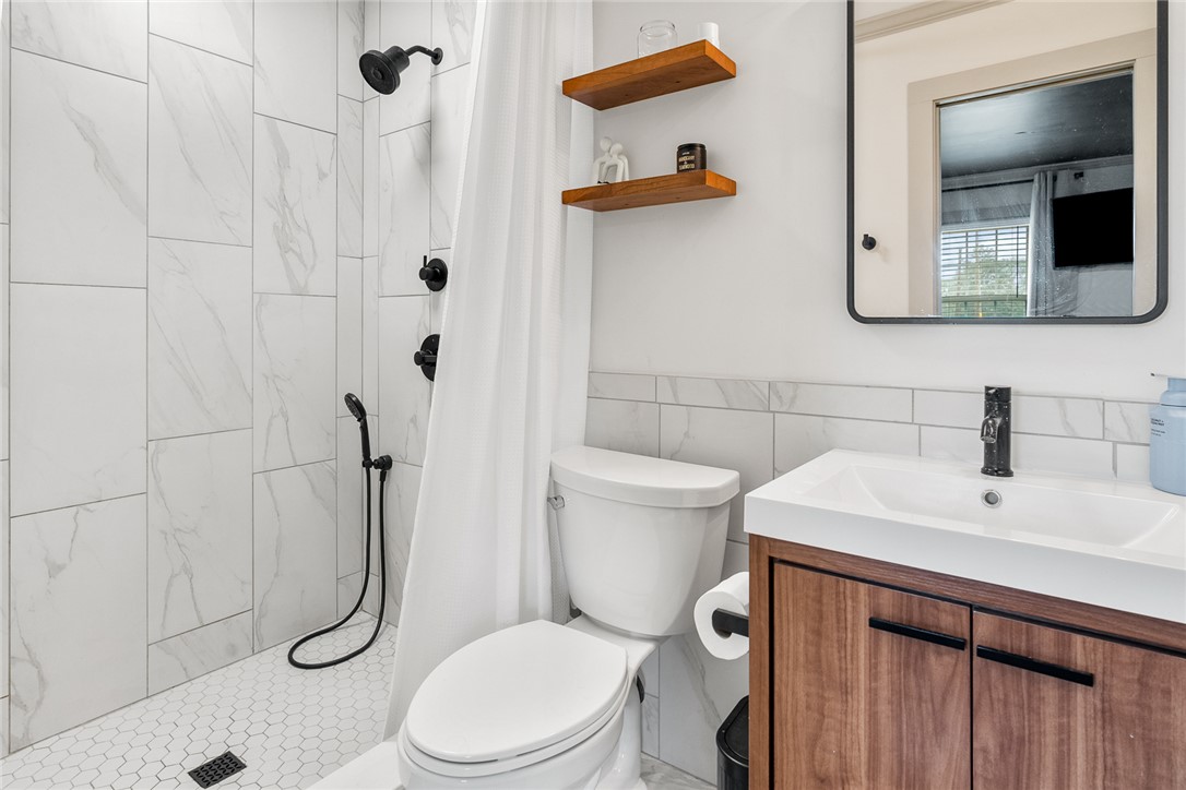 4508 Old Williamston Road Belton, SC 29627 - Photo 18 of 47 The primary bathroom boasts a modern shower with clean lines and functional design.