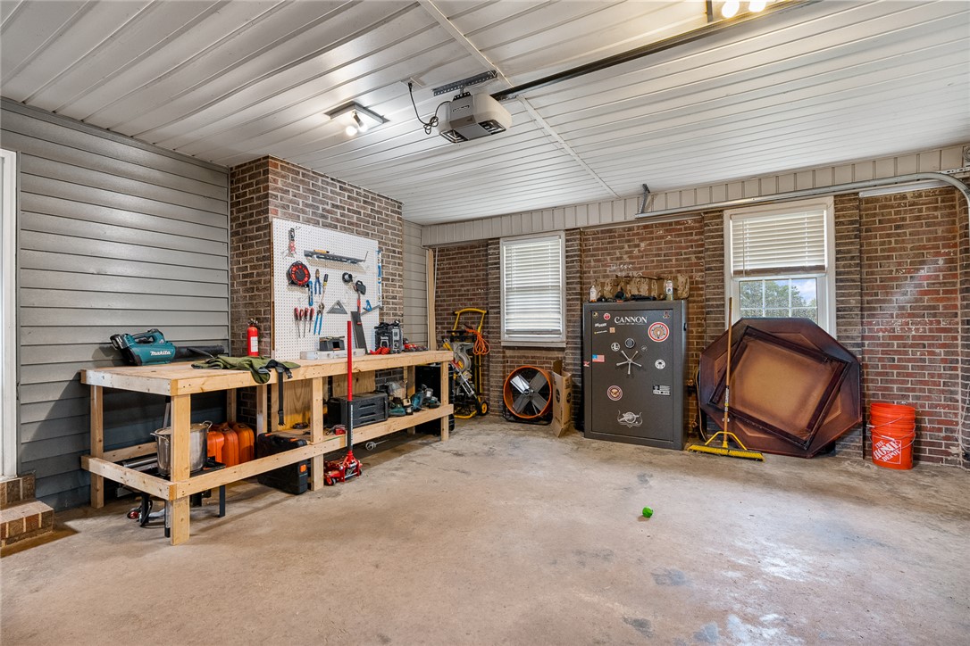 4508 Old Williamston Road Belton, SC 29627 - Photo 23 of 47 Functional garage with ample workspace and natural light for various projects.