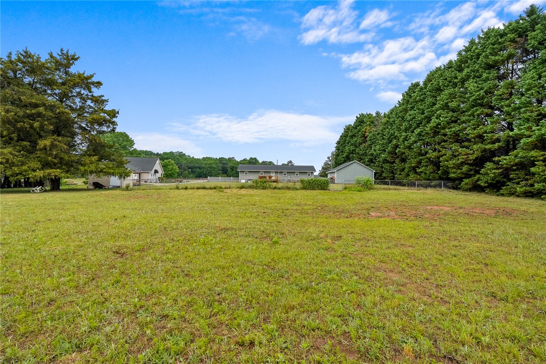 4508 Old Williamston Road Belton, SC 29627 - Photo 37 of 47 Expansive green yard with ample space for outdoor enjoyment and potential.