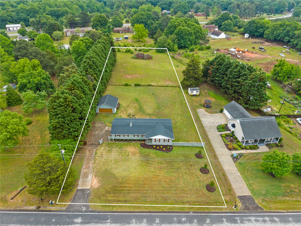 4508 Old Williamston Road Belton, SC 29627 - Photo 39 of 47 This expansive lot features a welcoming home and ample green space, perfect for outdoor enjoyment.
