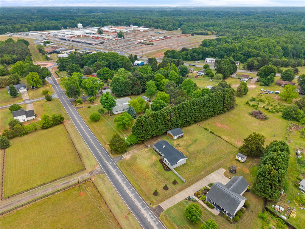 4508 Old Williamston Road Belton, SC 29627 - Photo 42 of 47 This elevated perspective showcases expansive land with residential structures and mature tree lines.