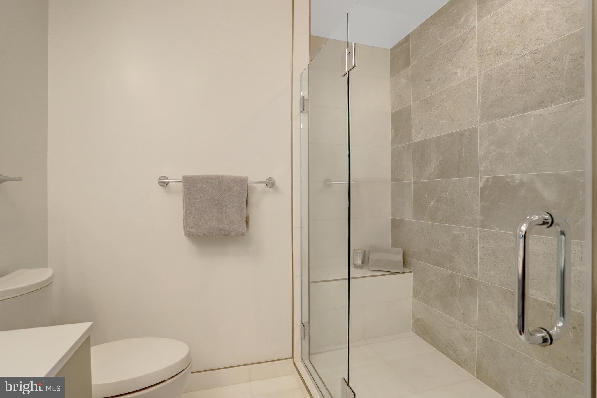 801 North Fairfax Street, Unit 314 Alexandria, VA 22314 - Photo 22 of 61 a bathroom with a toilet and a shower