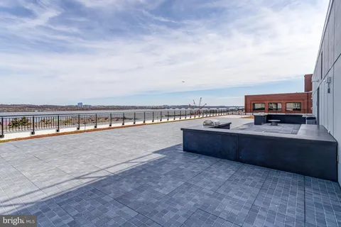 a view of swimming pool with seating area
