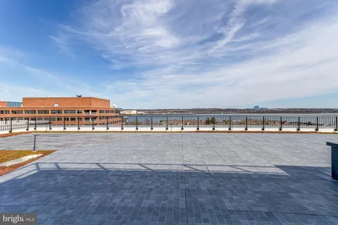 a view of a yard with wooden fence