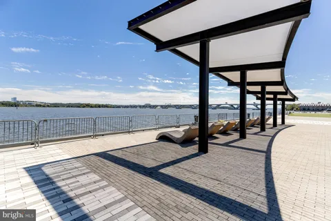 a view of steet with glass door and outdoor seating