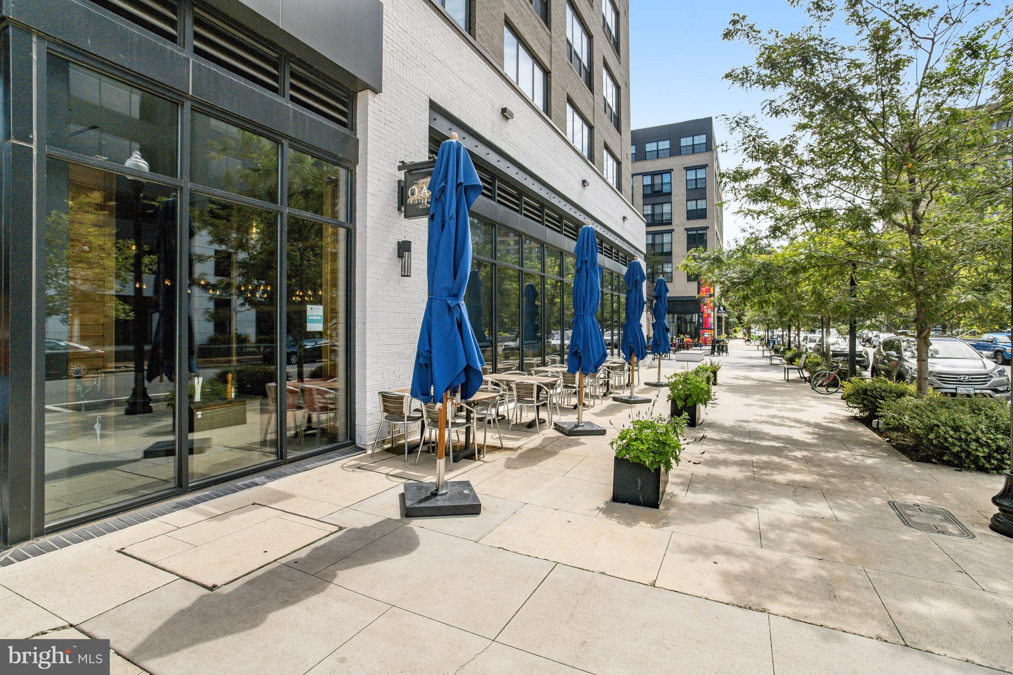 801 North Fairfax Street, Unit 314 Alexandria, VA 22314 - Photo 53 of 61 a view of steet with glass door and outdoor seating