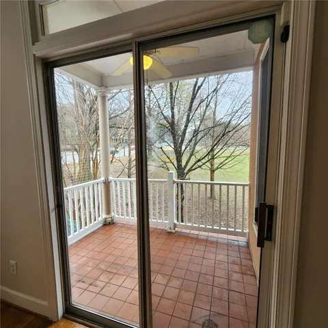 a kitchen with granite countertop a refrigerator stove top oven and sink