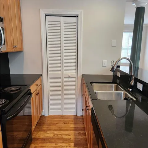 a view of an entryway with wooden floor