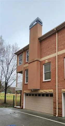a view of a house with a street