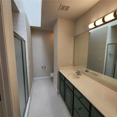 a bathroom with a sink a mirror and vanity