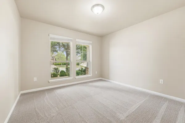 an empty room with windows