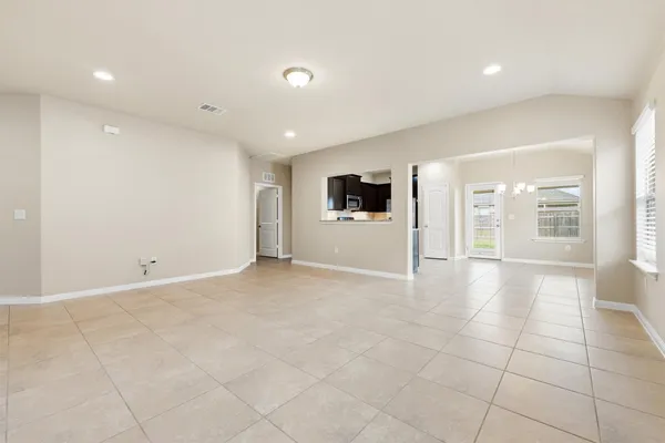 a view of an empty room with a window