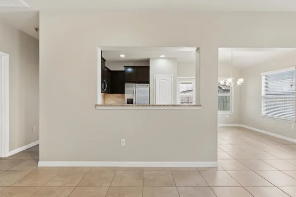 a view of a hallway with wooden shelves