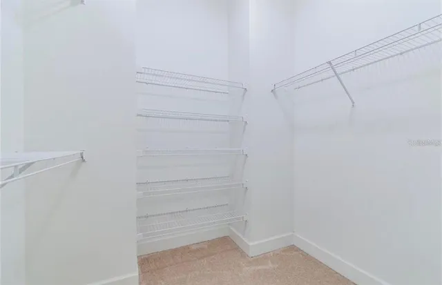 a view of an empty walk in closet