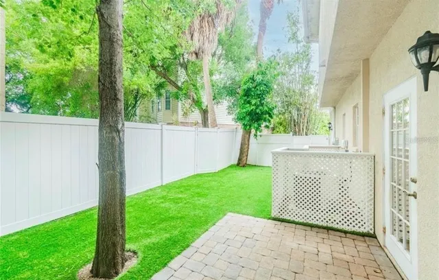 a view of a house with a backyard