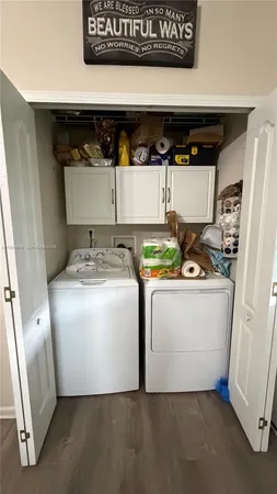 a utility room with dryer and washer