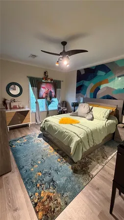 a bed sitting in a bedroom and dressers