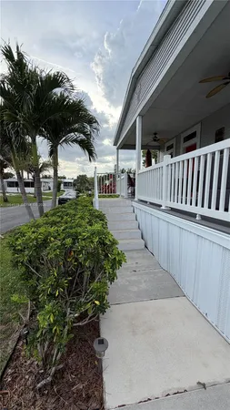 a view of a backyard with pathway
