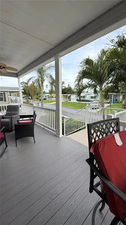 a view of a balcony with chairs