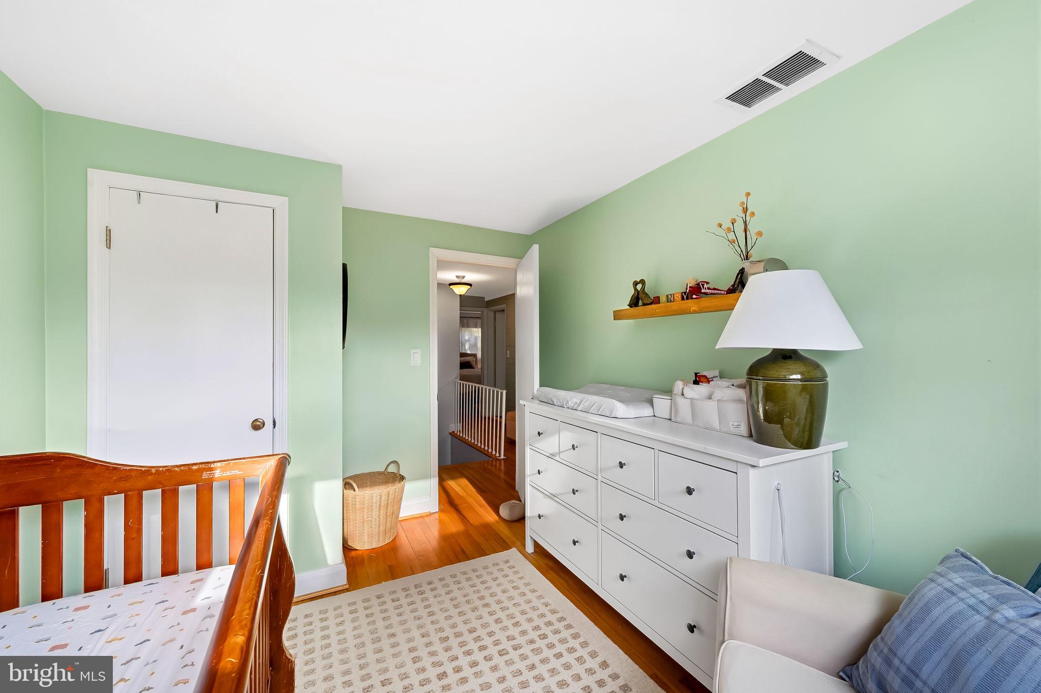 6745 Glenkirk Road Baltimore, MD 21239 - Photo 23 of 35 a room with furniture and window