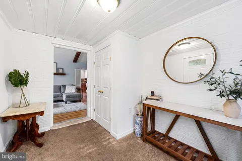 a view of an entryway with sitting area