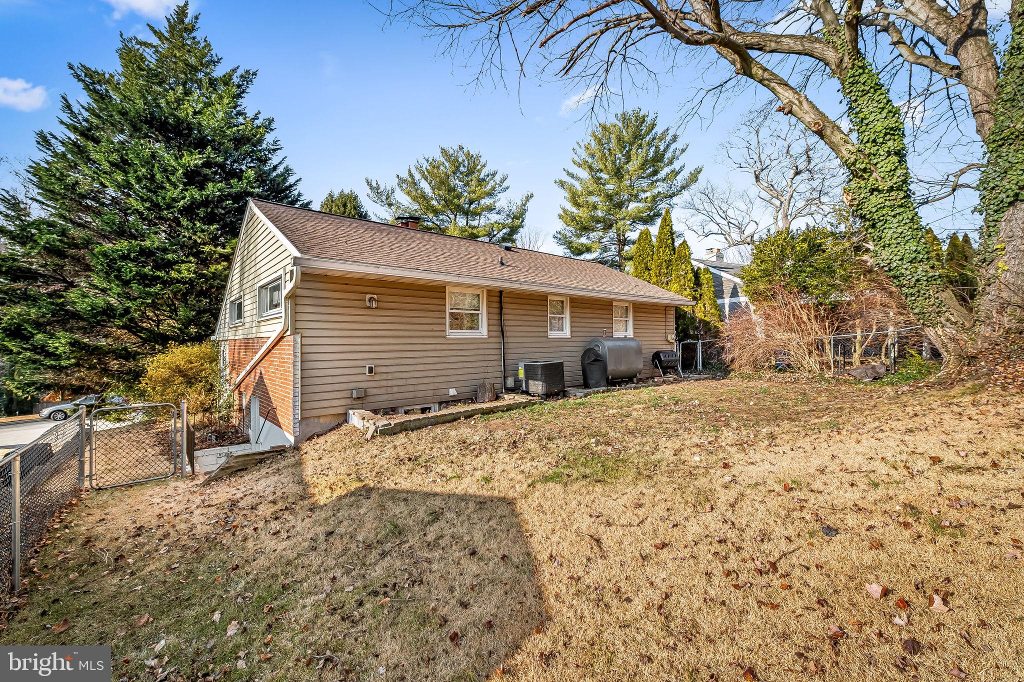 6745 Glenkirk Road Baltimore, MD 21239 - Photo 32 of 35 a front view of house with yard covered in snow
